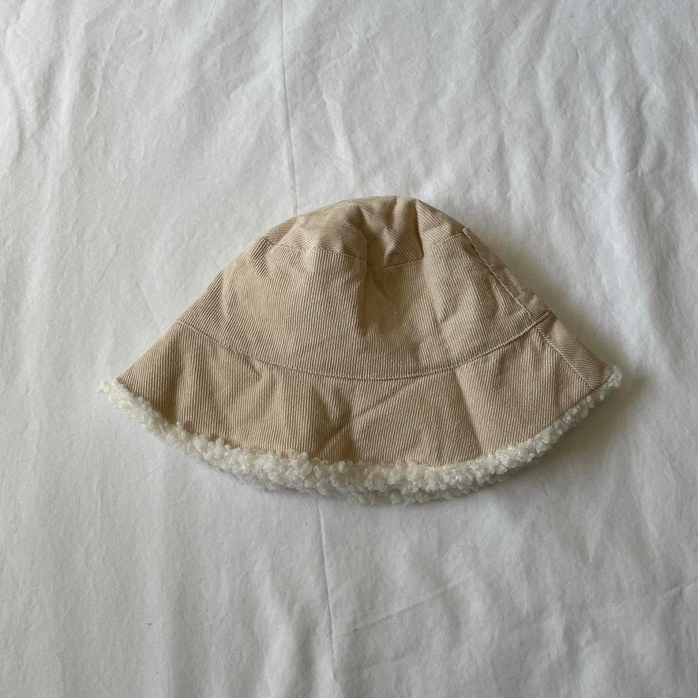 Light brown and white bucket hat